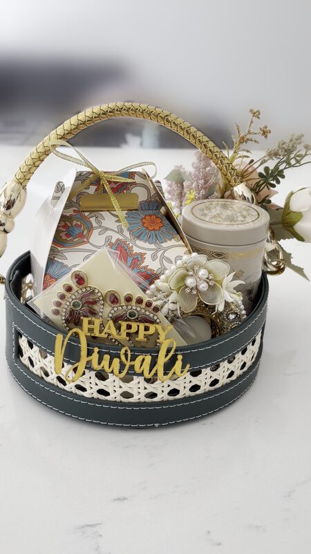 Green cane basket with golden handle and Happy Diwali sign