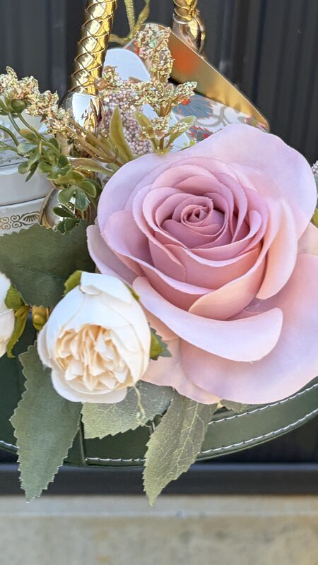 Pink rose and cream peonies on the basket