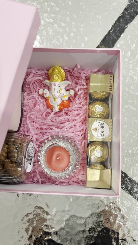 Inside: Ganesha idol, diya and Ferrero Rocher